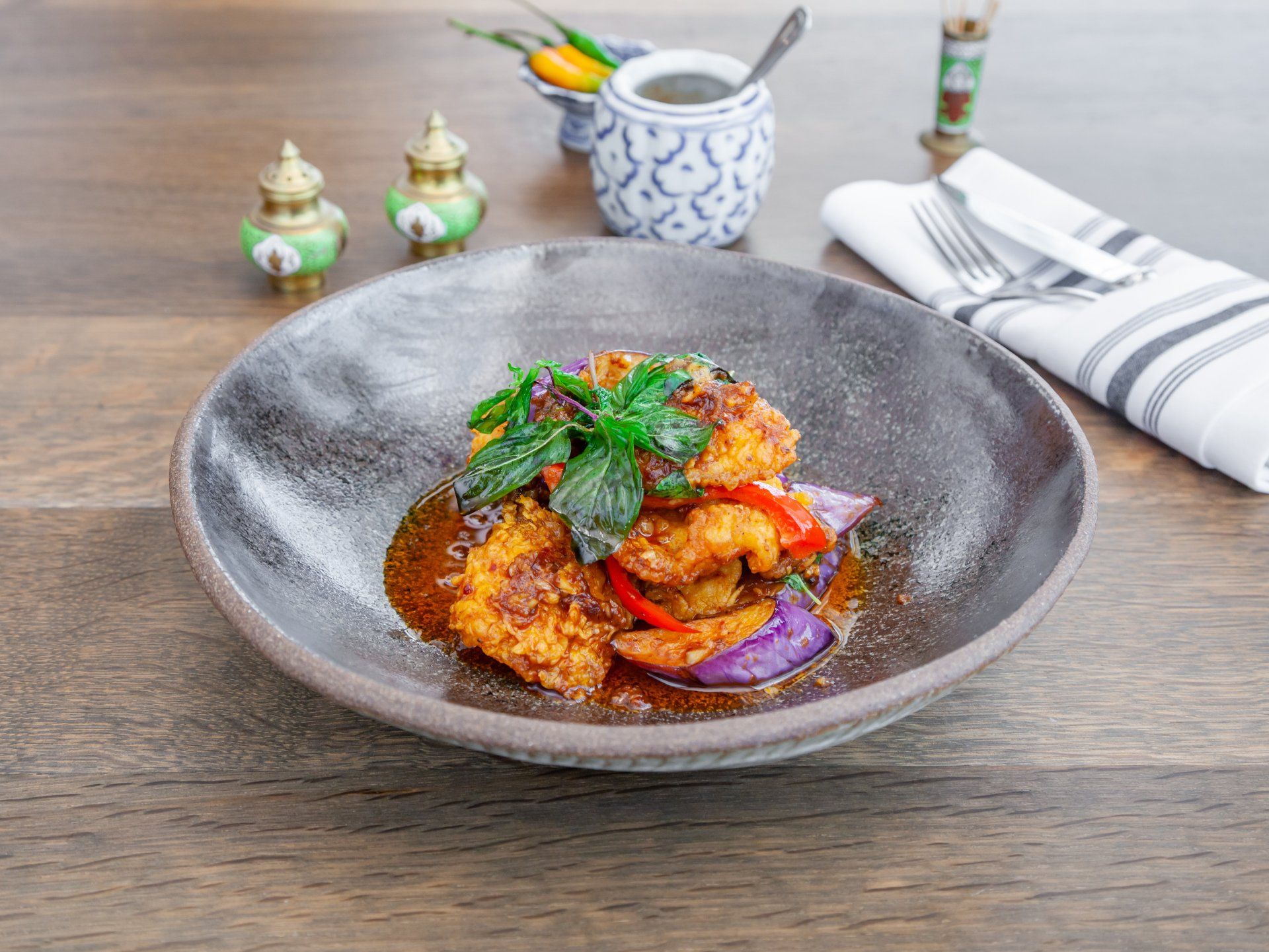 Another popular dish of crispy catfish topped with simi-sweet red curry paste.