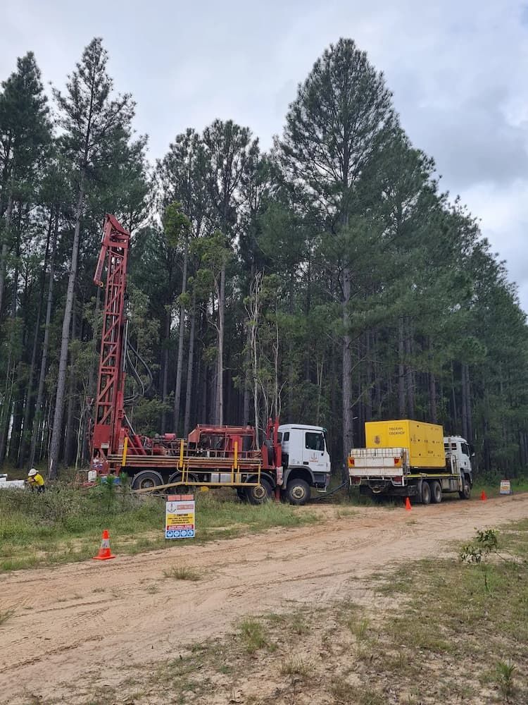 Drilling Rig and Power Generator Set Up at the Site — Grid Drilling in Munduberra, QLD