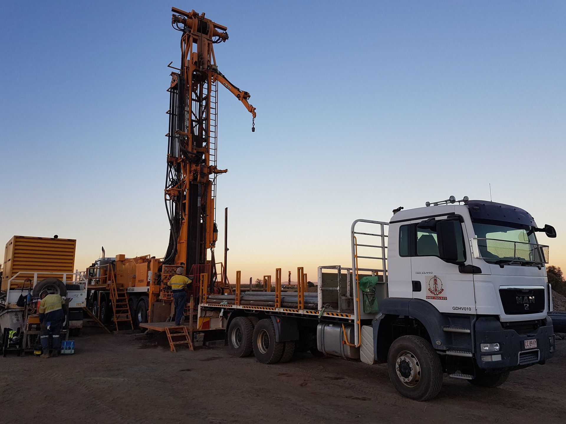 Men Preparing the Heavy Equipment for Drilling — Grid Drilling in Agnes Water, QLD
