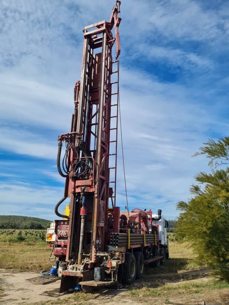 Workers Establishing Boreholes with a Drilling Rig — Grid Drilling in Bucca, QLD