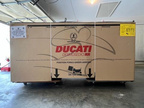 A large cardboard box with ducati written on it
