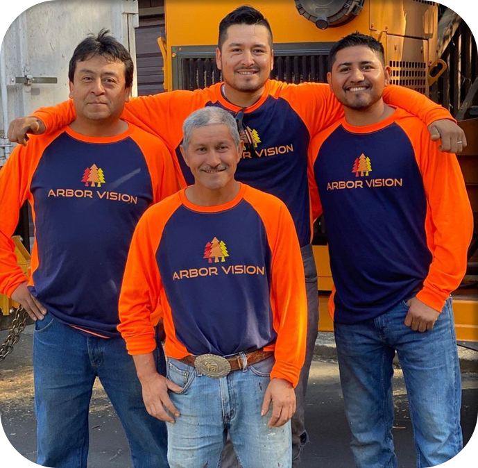 A group photo of certified arborists from Arbor Vision Inc. wearing their company shirt