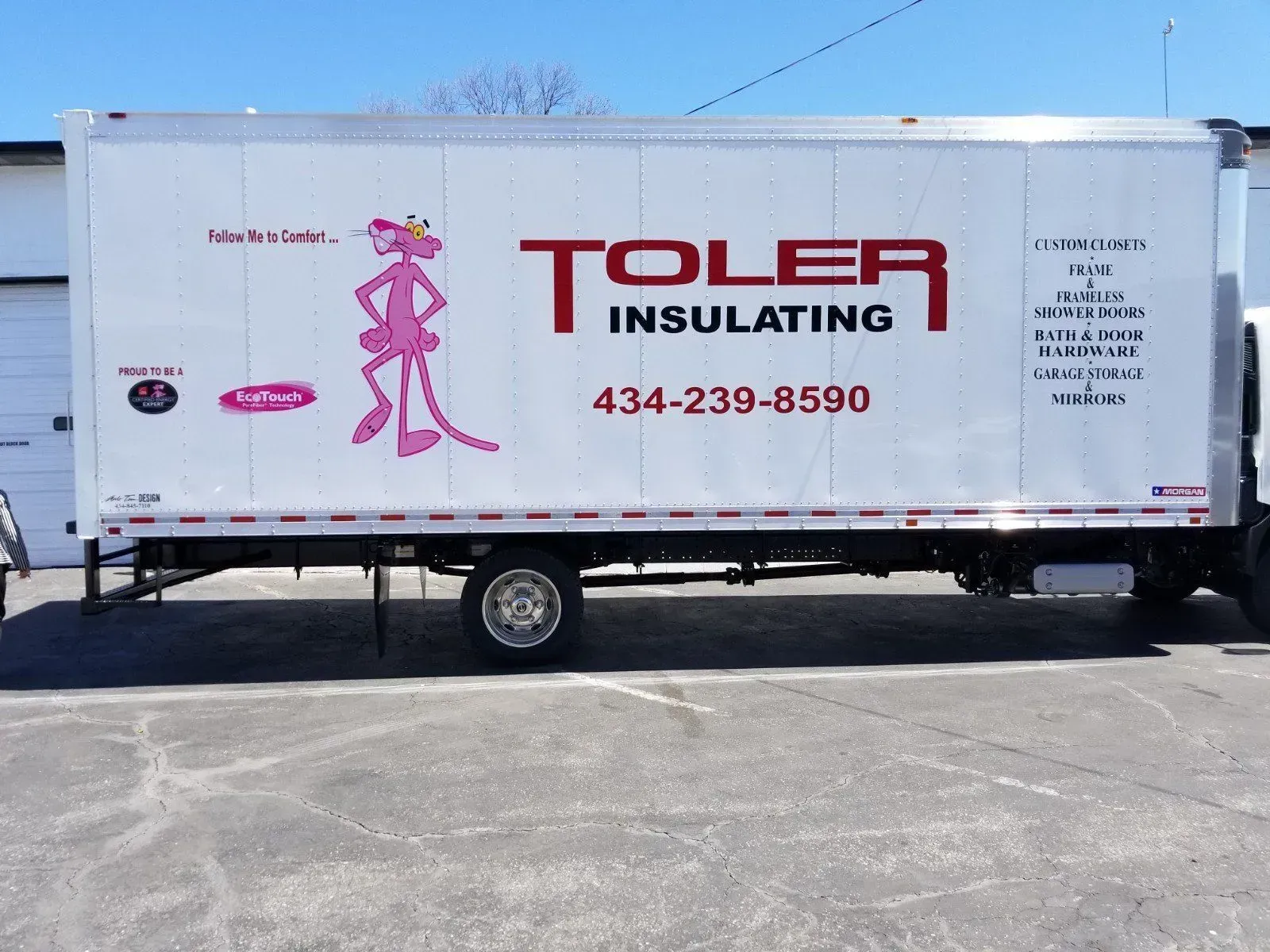 A toler insulating truck is parked in a parking lot.