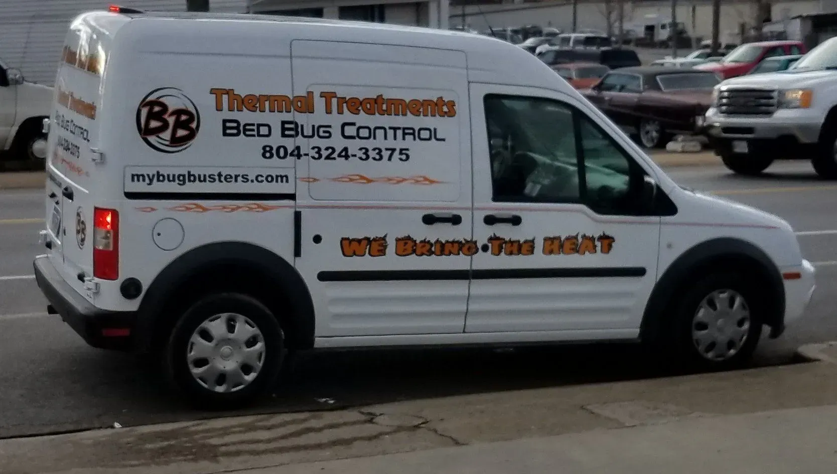 A white van with thermal treatments bed bug control written on it.