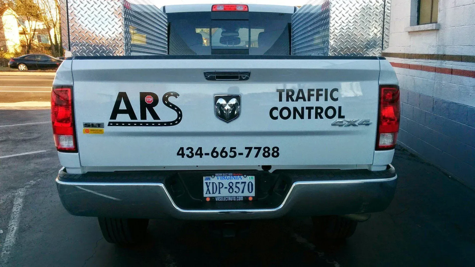 A white truck that says ars traffic control on the back.