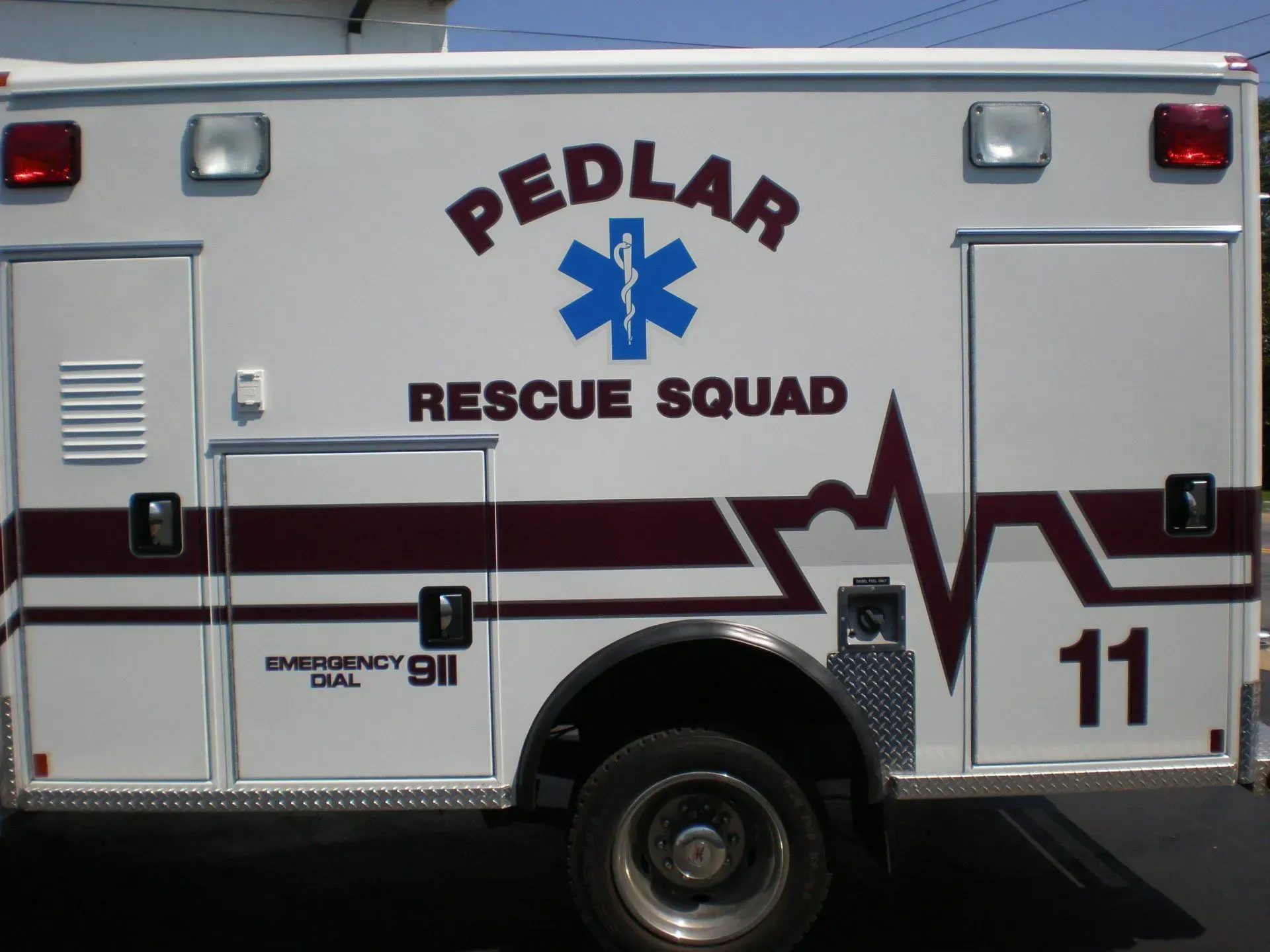 An ambulance with the word pedilar on the side.