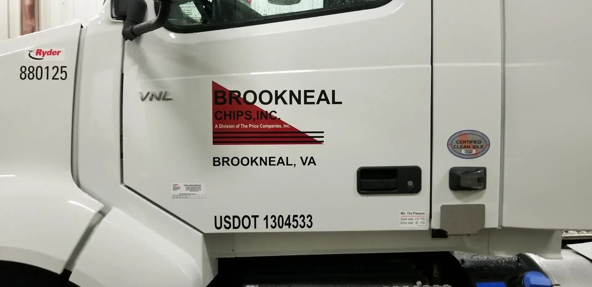 A white truck with the word brookneal on the side.