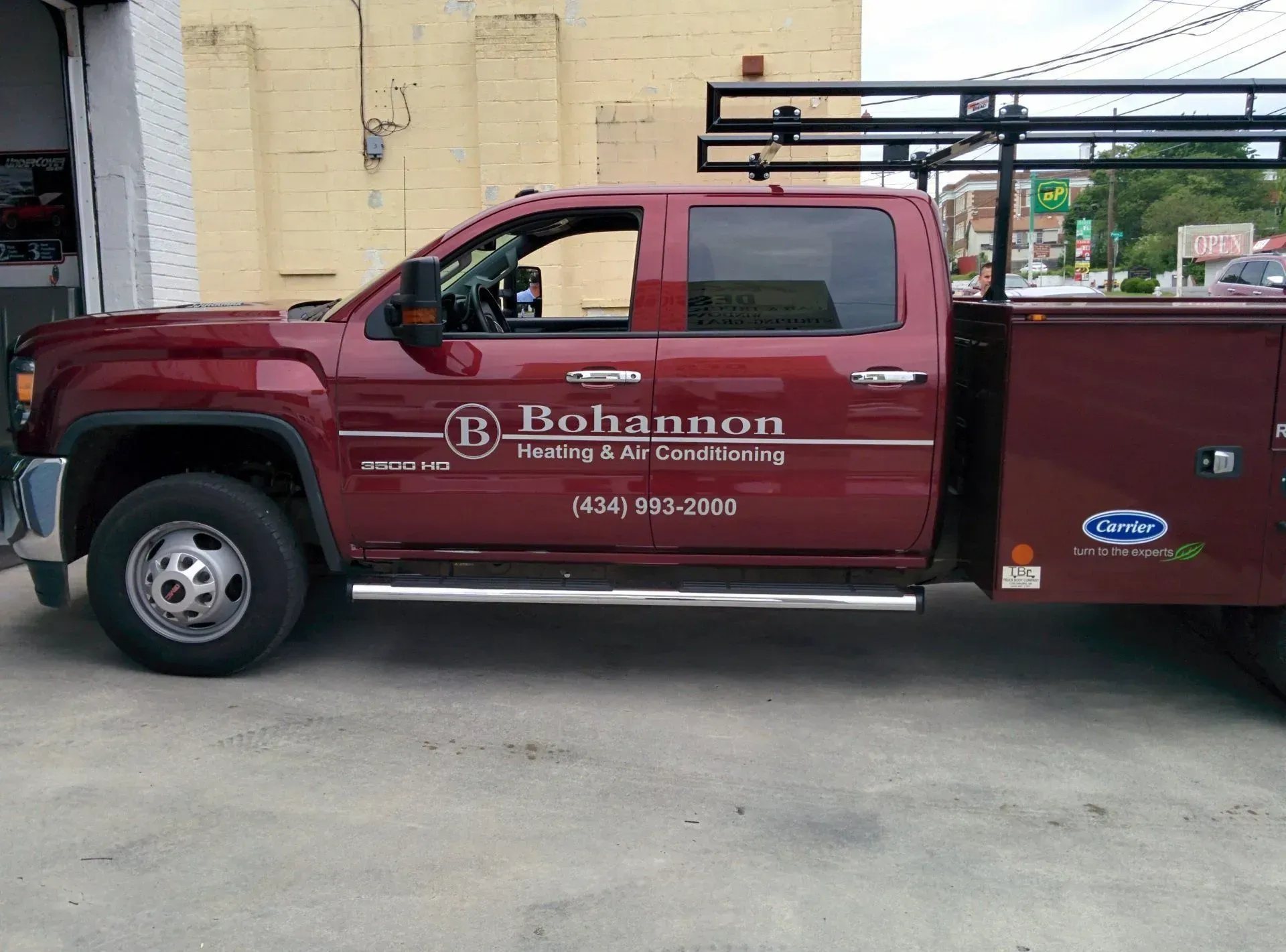 A red truck with the word johnson on the side.