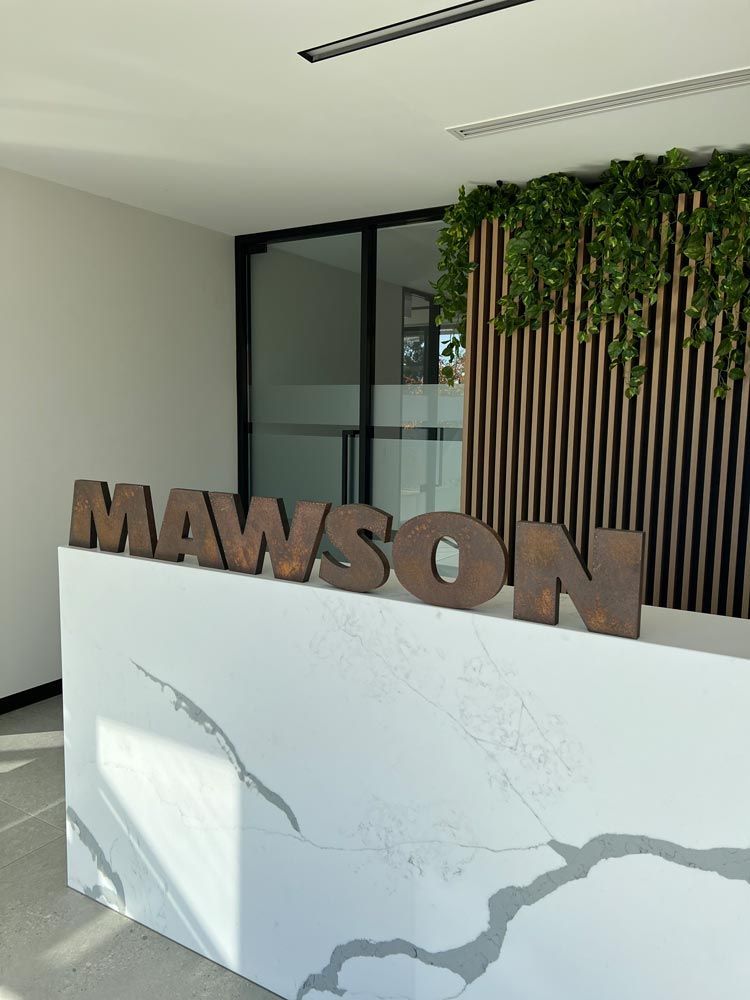 A White Counter with the Word Mawson Written on it — Mawson Constructions in Kialla, VIC