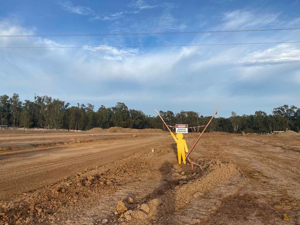 Yellow Man is Standing in the Middle of the Field — Mawson Constructions in Kialla, VIC