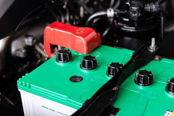 Car battery with terminals and protective cover