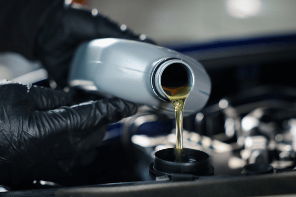 Motor oil being poured into engine