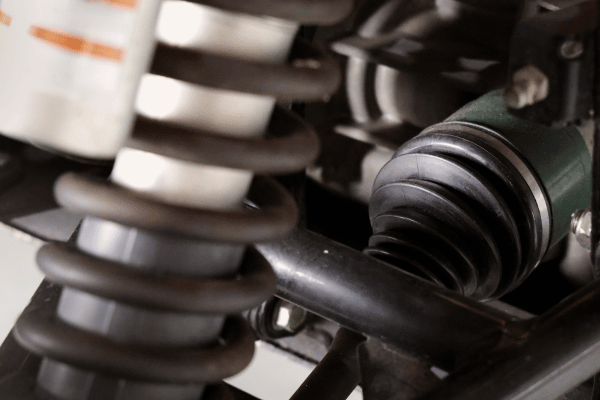 Close-up of suspension spring and axle