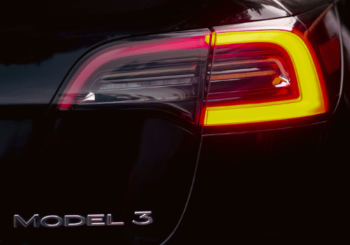 Close-up of a car’s illuminated taillight with modern LED design.