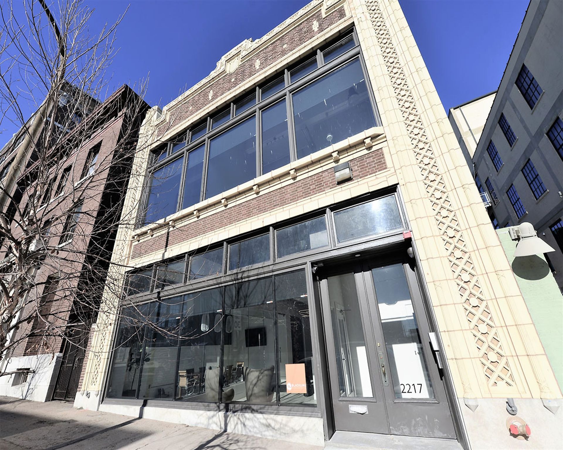 A large building with a lot of windows and a door