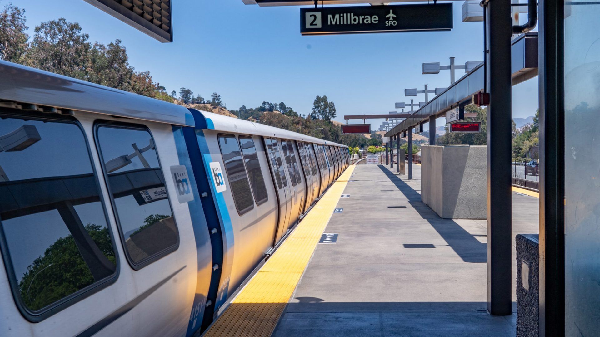 A train at the Millbrae BART station, on a bright sunny day at The Waymark in Walnut Creek, CA.