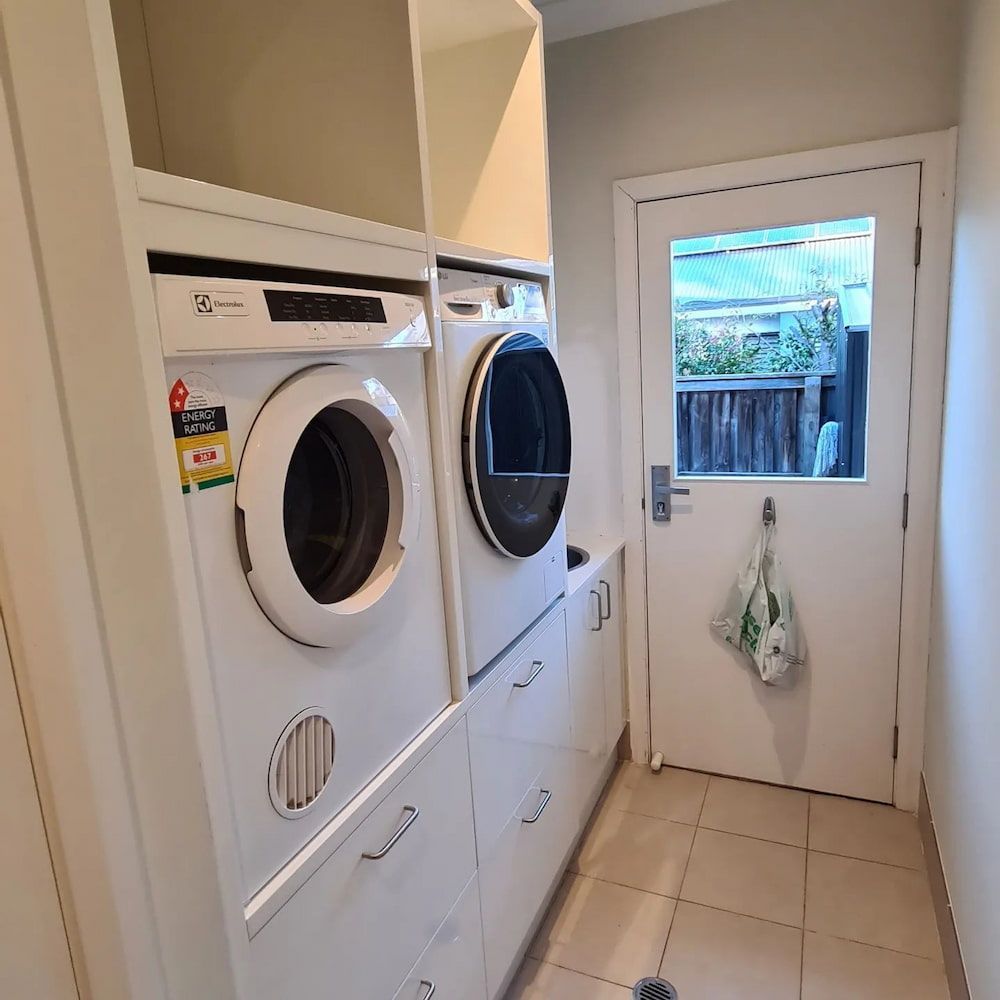 A Laundry Room With A Washer — The Kitchen & Bathroom Doctor in Medowie, NSW