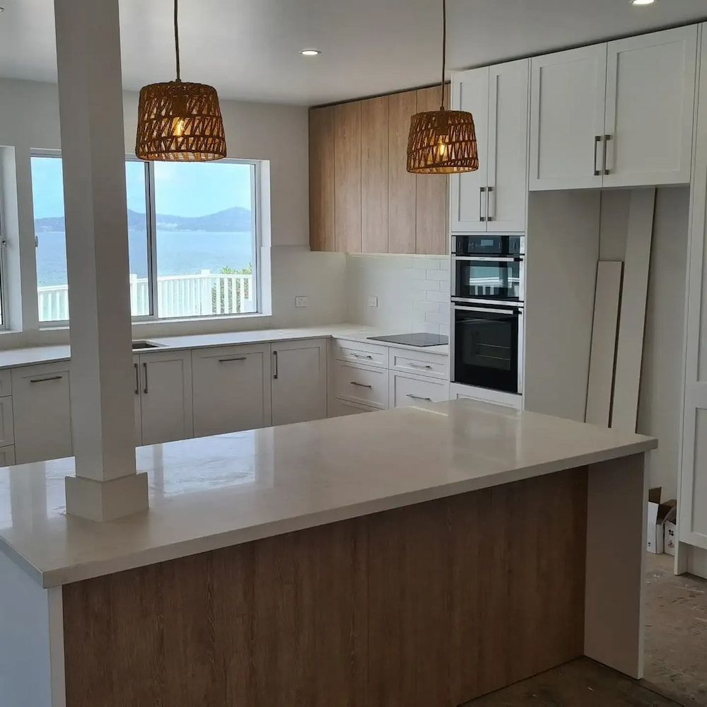 A Kitchen With White Cabinets — The Kitchen & Bathroom Doctor in Medowie, NSW