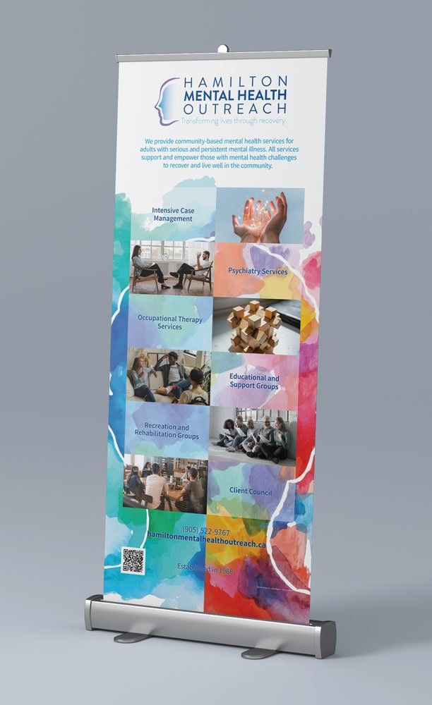 Tall Cawthron Mental Health Outreach banner with colorful collage on a silver stand