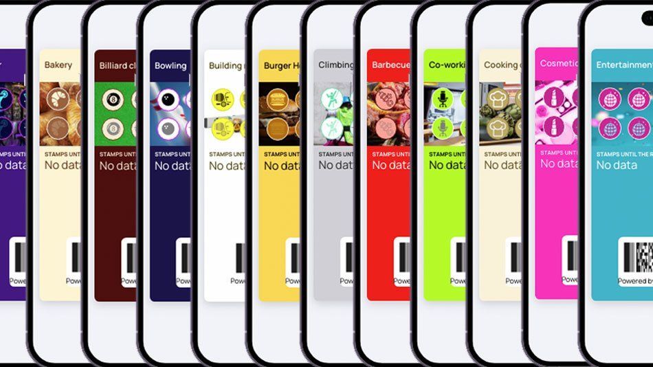 Row of colorful bottled drink labels lined up side by side on a white background