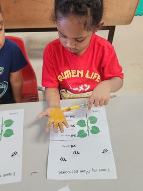Childcare Columbus — A Young Girl is Coloring Her Hand Yellow in Columbus, OH Childcare Columbus — A Young Girl is Coloring Her Hand Yellow in Columbus, OH