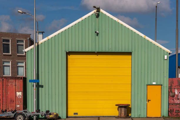 Green Garage With Steel Yellow Roller Shutter | Salem, OR - Itiel's Carports