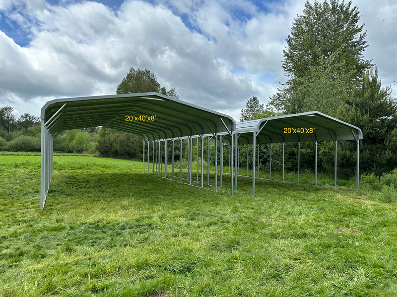 A row of carports sitting on top of a lush green field.