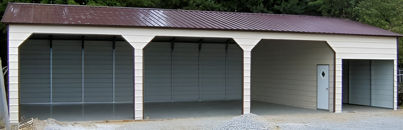An empty garage with a brown roof and white doors.
