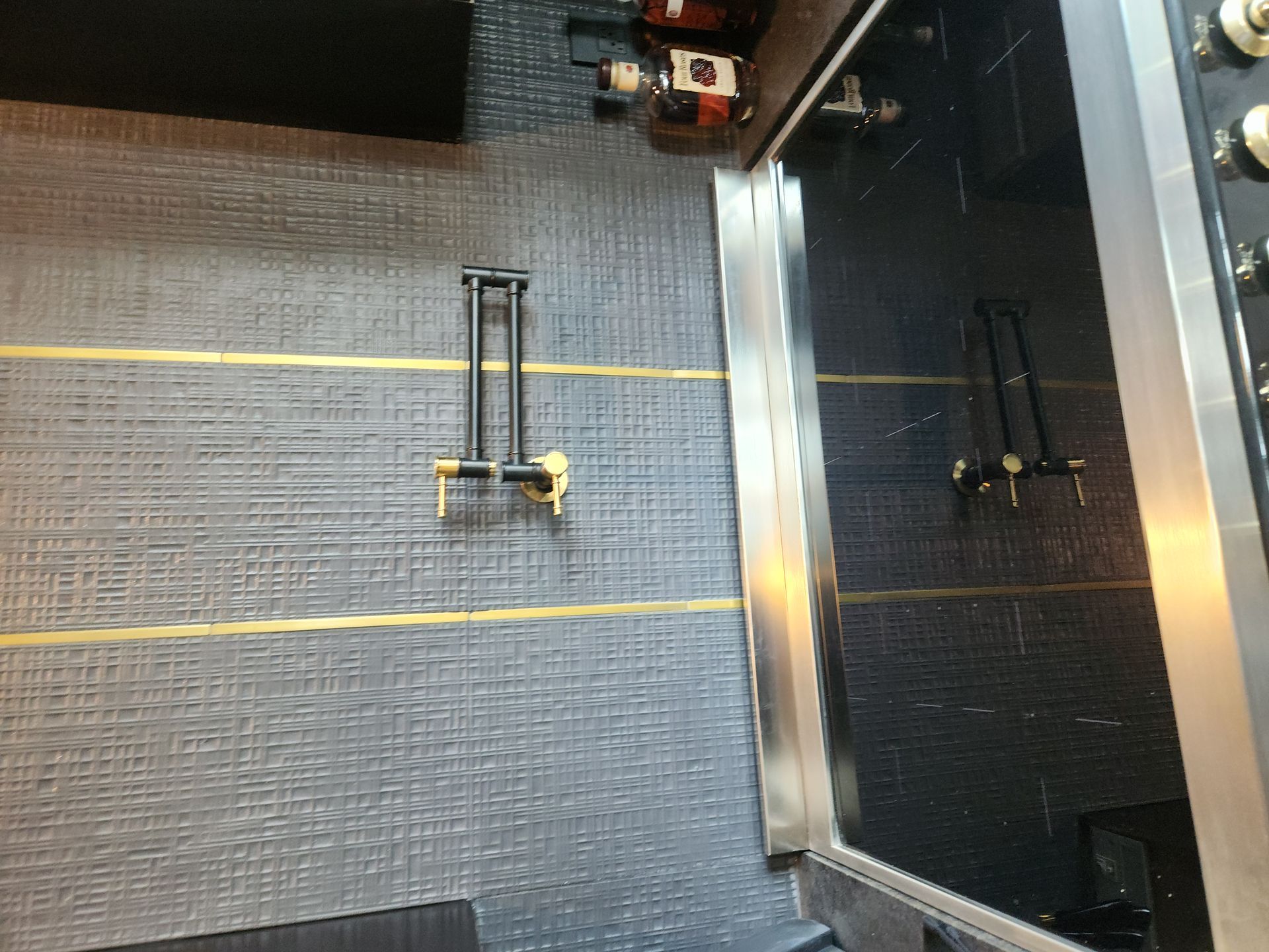 Empty airport security lane with yellow guide lines and a metal scanner gate on the right.