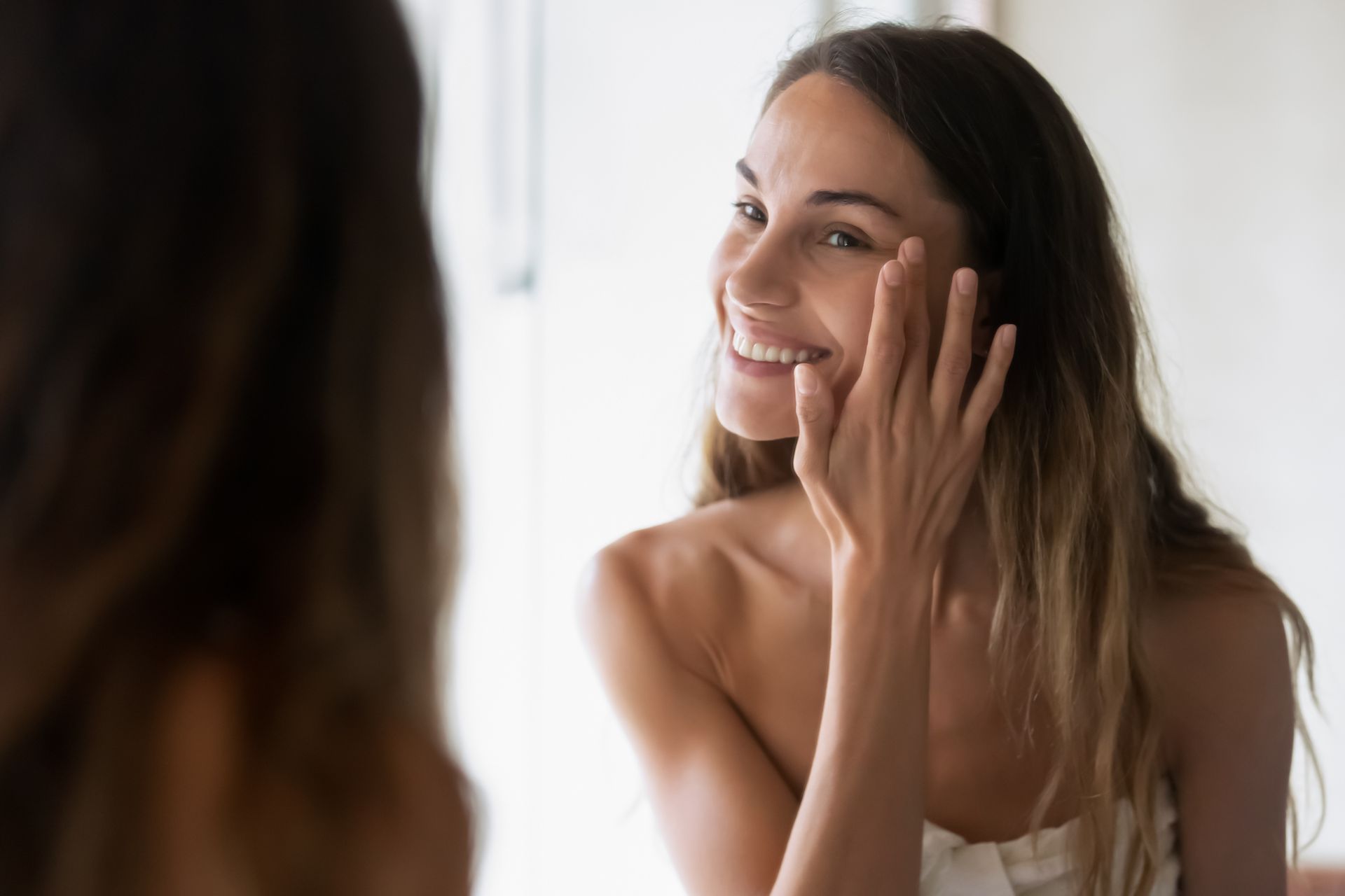 a woman is getting a facial treatment at a spa .
