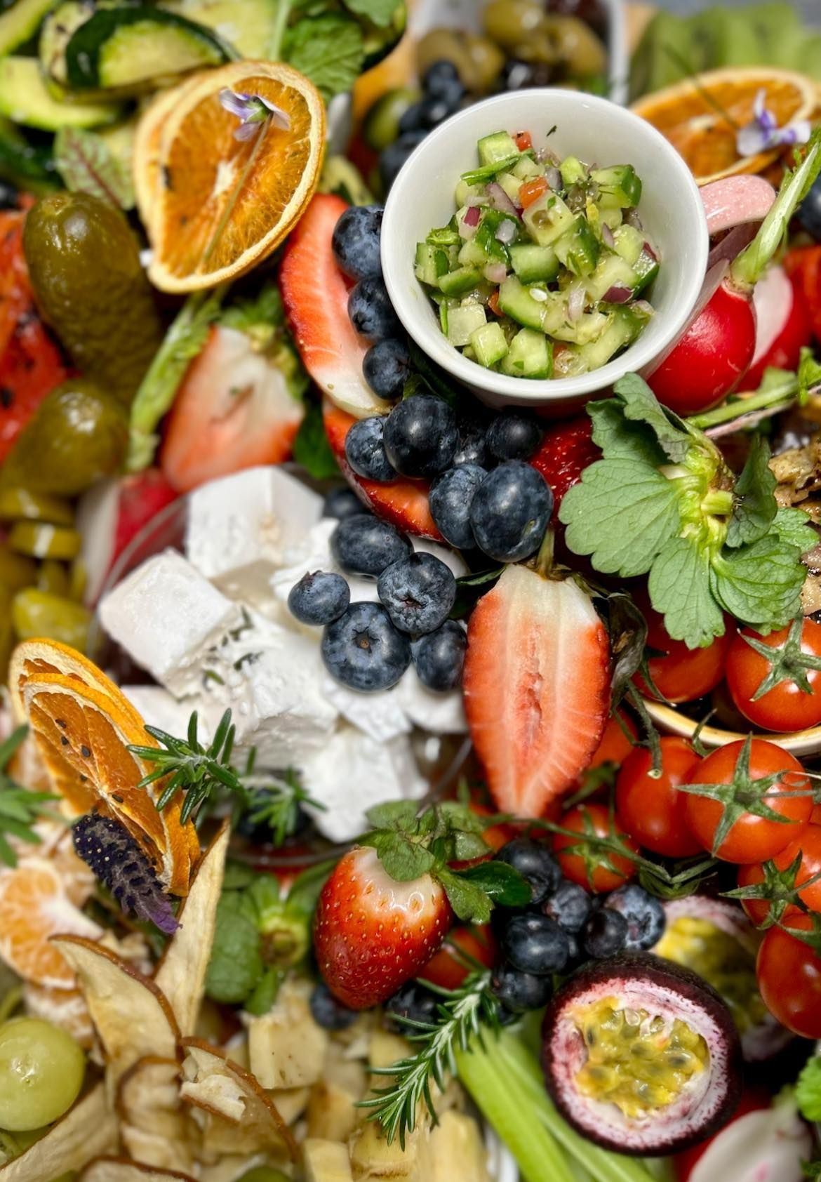 A colorful charcuterie board with fruits, vegetables and cheese — Amanda Douglass Catering Service in Corlette, NSW