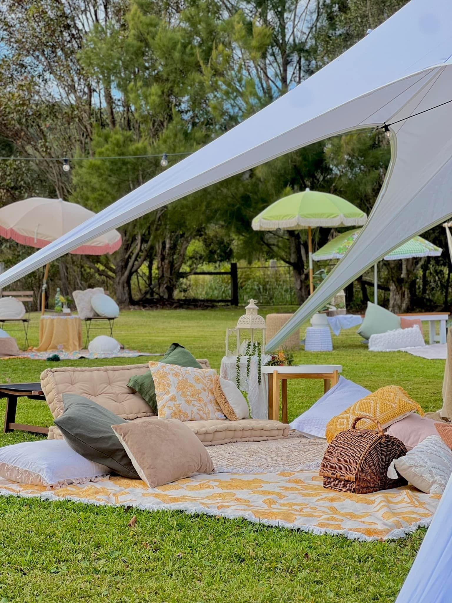 Outdoor Picnic Setting With Lounge Seating, Pillow, Stretch Tent — Amanda Douglass Catering Service in Corlette, NSW