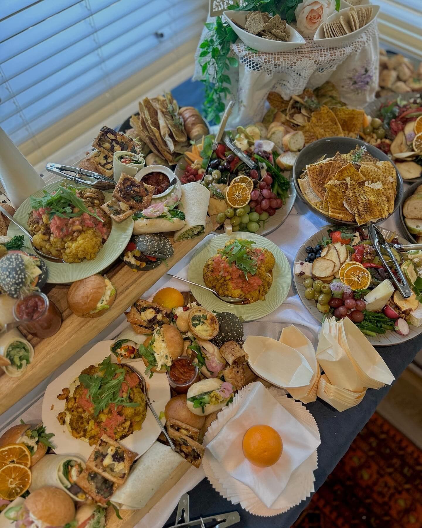 A table of catering with rolls and fruit — Amanda Douglass Catering Service in Corlette, NSW