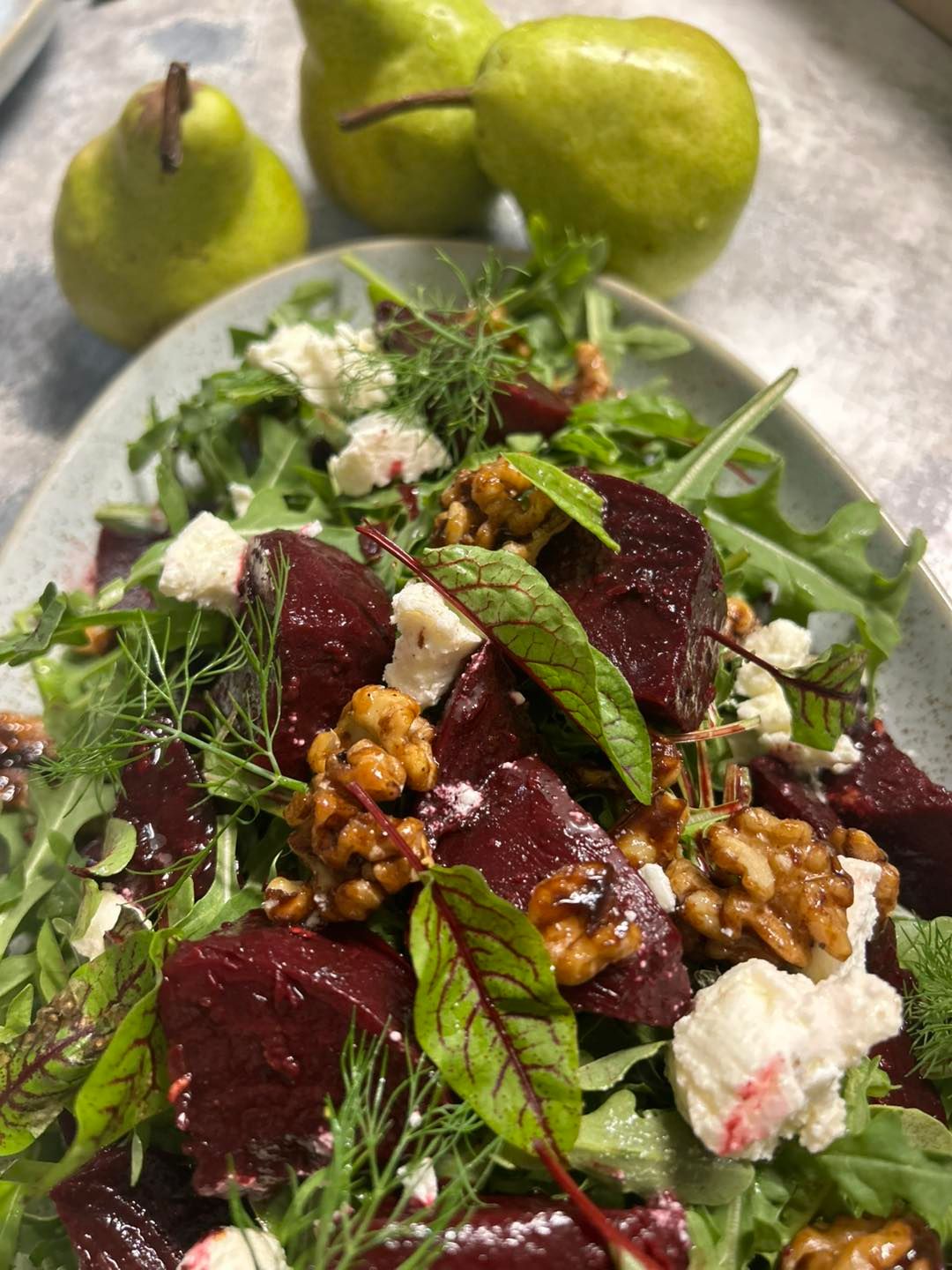 A beetroot salad is topped with leaves — Amanda Douglass Catering Service in Corlette, NSW