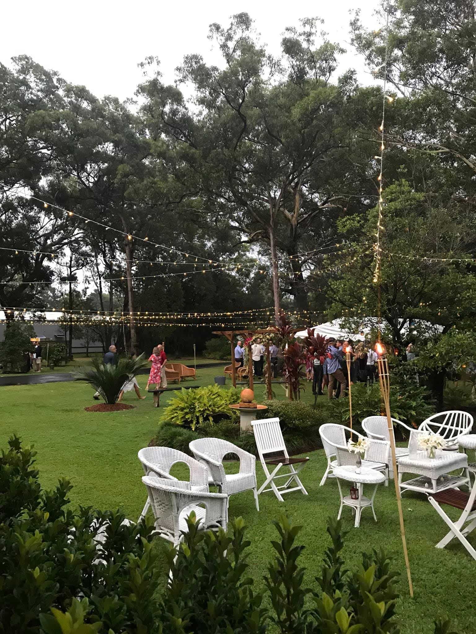 Outdoor Party With White Furniture on a Green Lawn — Amanda Douglass Catering Service in Corlette, NSW