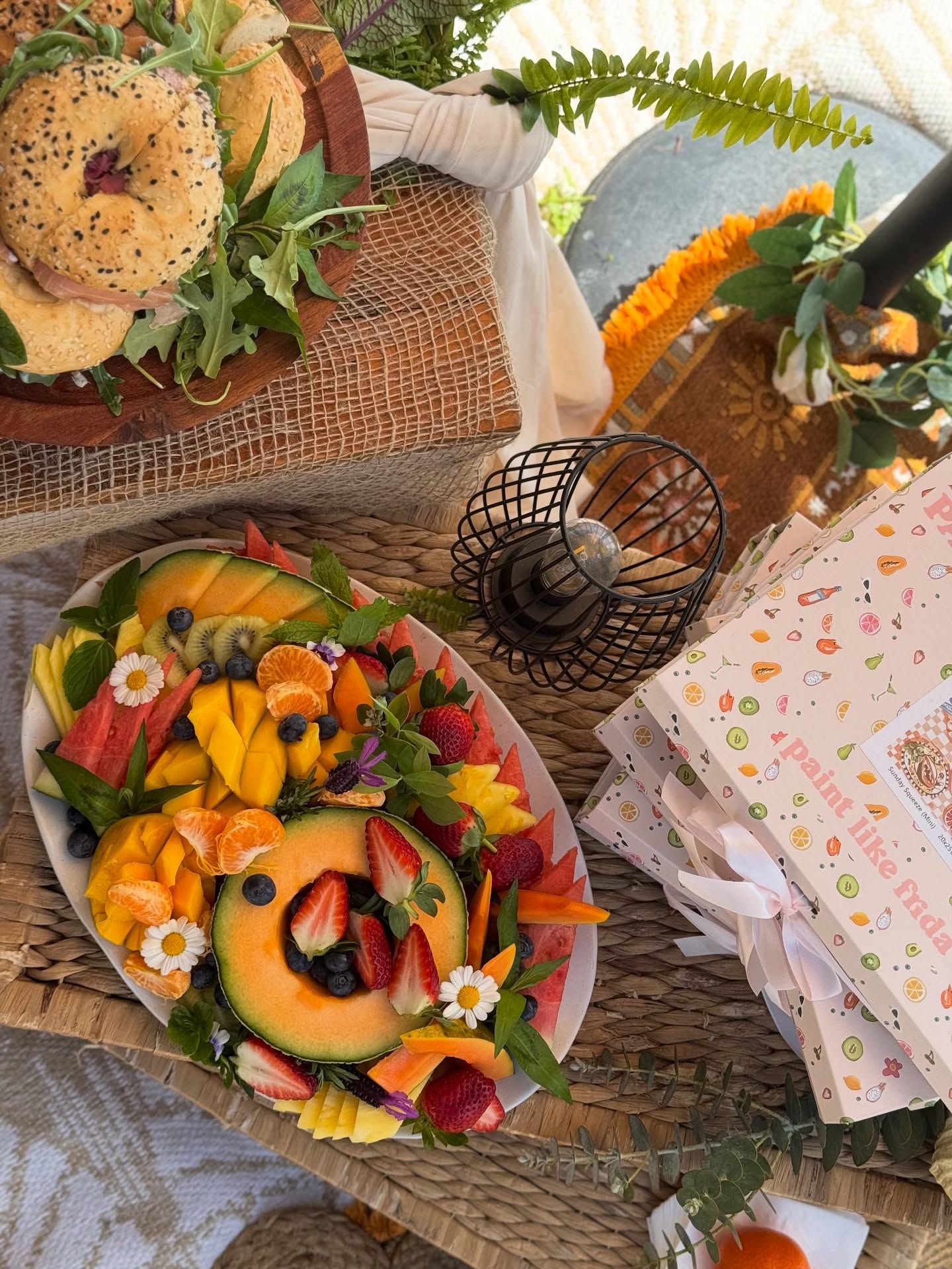 A fruit platter and bagels in the corner of image — Amanda Douglass Catering Service in Corlette, NSW