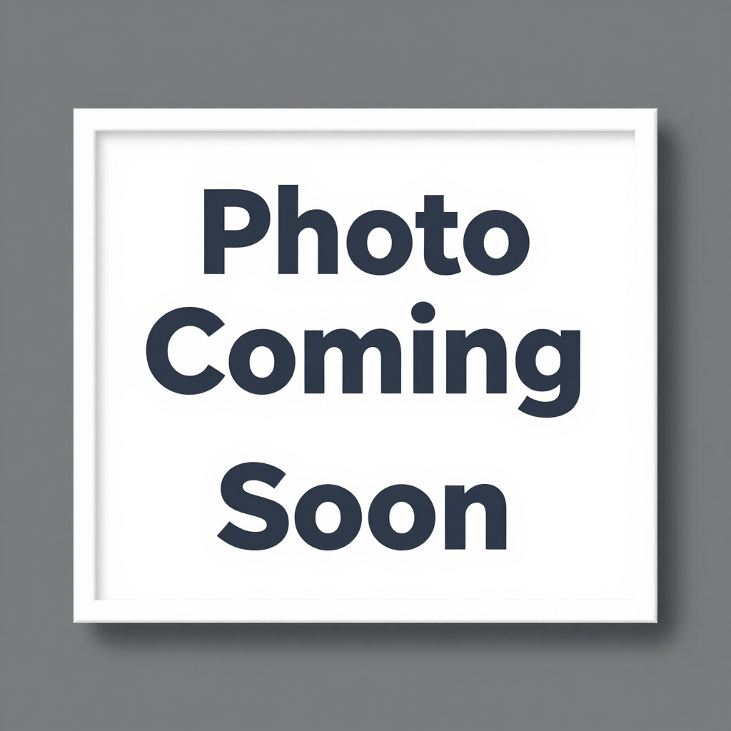 White placeholder sign with bold text reading “Photo Coming Soon”