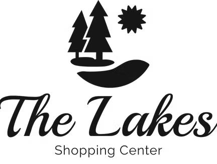 Logo for The Lakes Shopping Center featuring trees, a sun, and stylized lake with text.