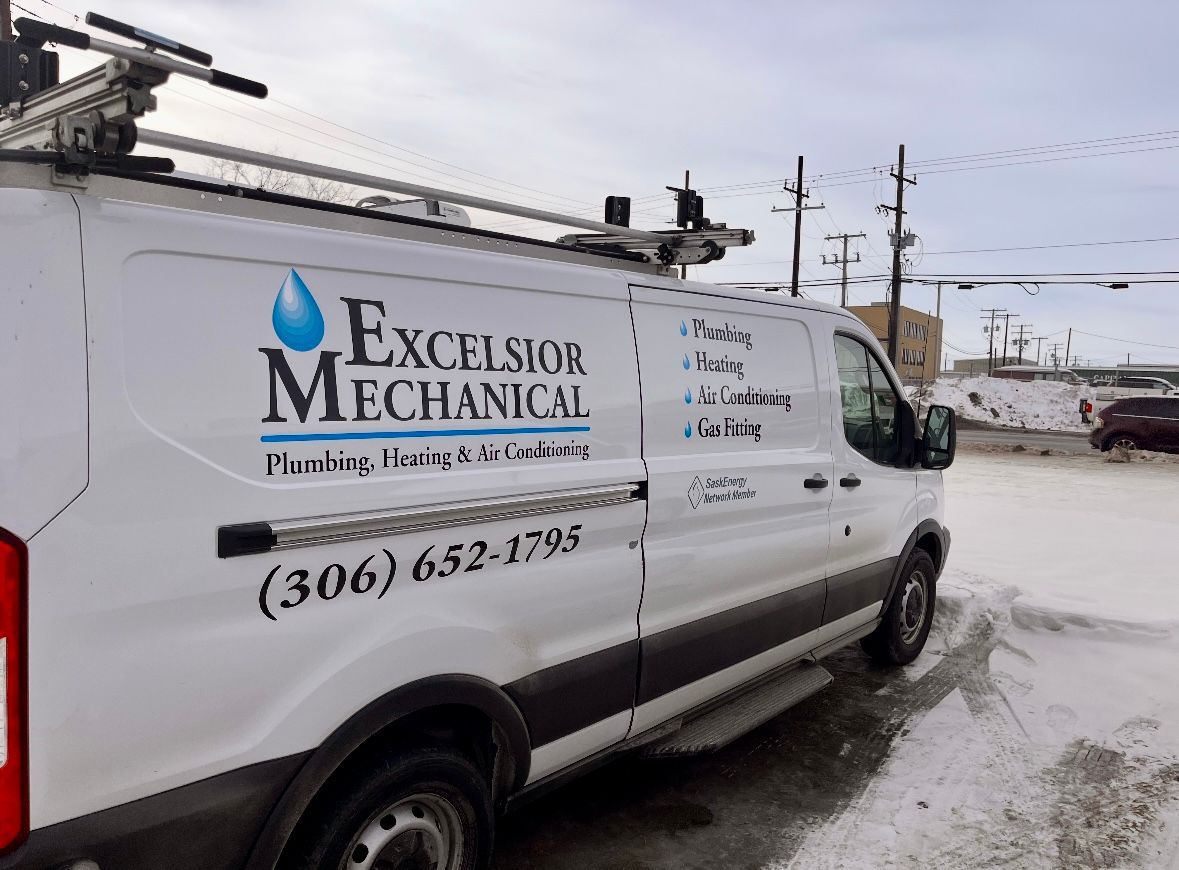 A white van with the word excelsior mechanical on it