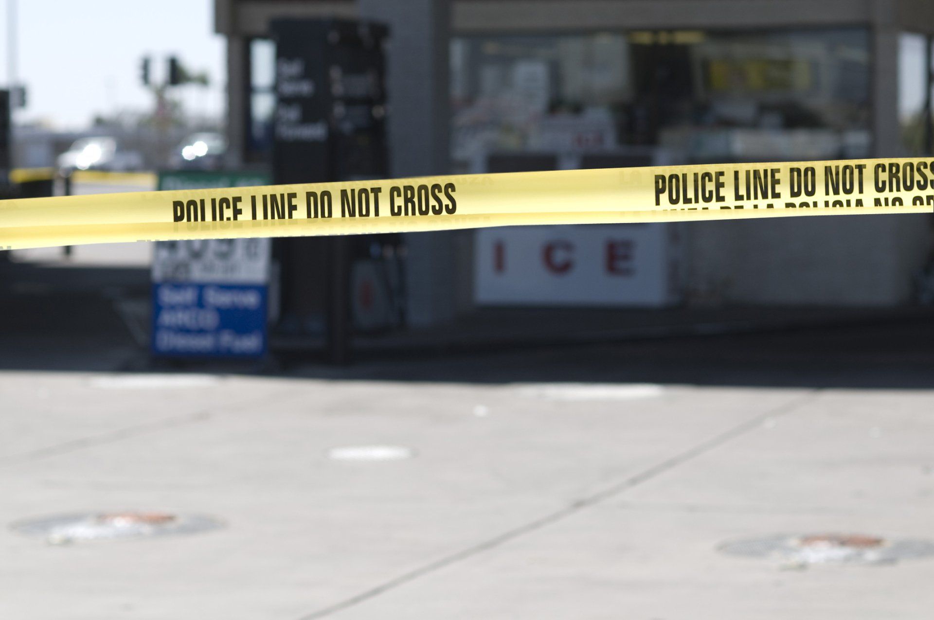 A yellow police tape says police line do not cross