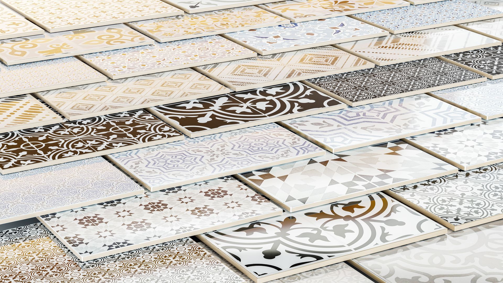 Patterned white and brown ceramic tiles laid in a decorative outdoor pavement