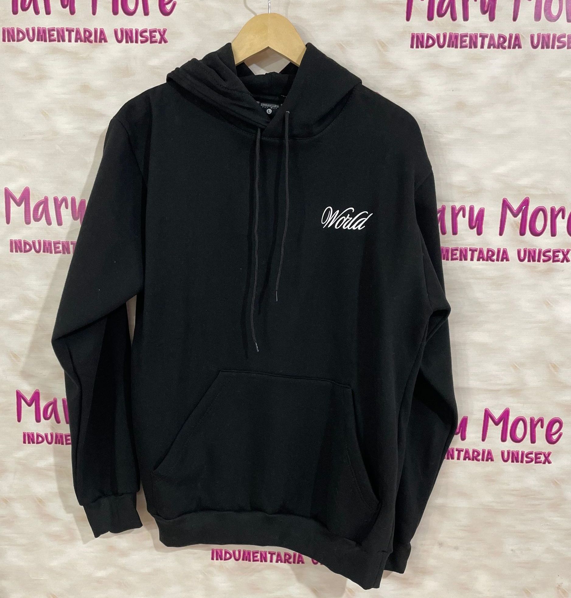 Una sudadera con capucha negra está colgada en una percha frente a una pared que dice Mary More.