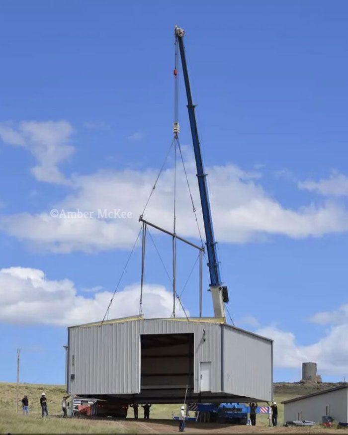 Crane Carrying a Storage Room — Gillette, WY — Black Hawk Crane & Rigging Inc