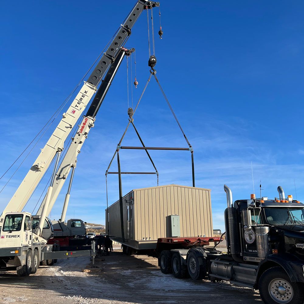 Placing Storage Room on A Truck — Gillette, WY — Black Hawk Crane & Rigging Inc