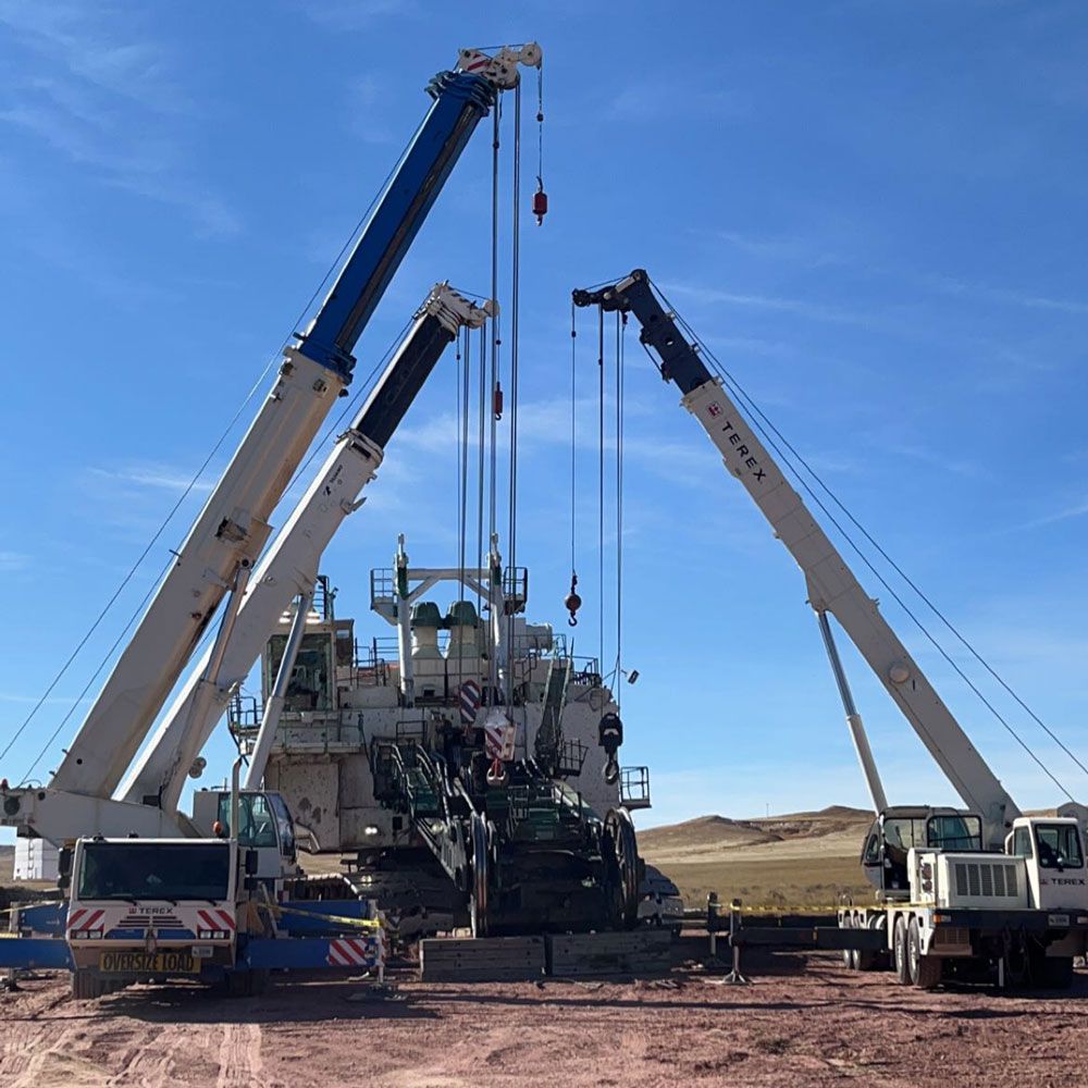 Crane Carrying Heavy Equipment — Gillette, WY — Black Hawk Crane & Rigging Inc