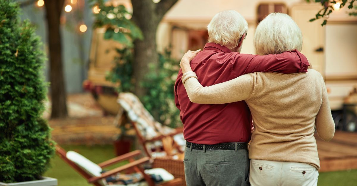 Seniors hugging in independent living 