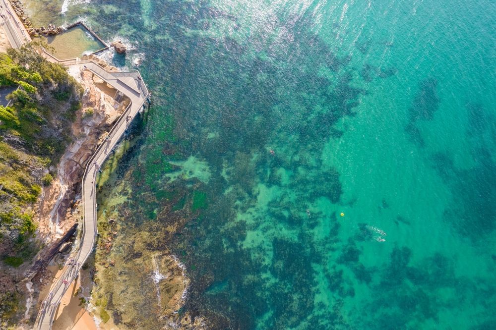 An Aerial View Of A Body Of Water With A Road Going Through It — BAS Plumbing & Drainage In The Entrance, NSW