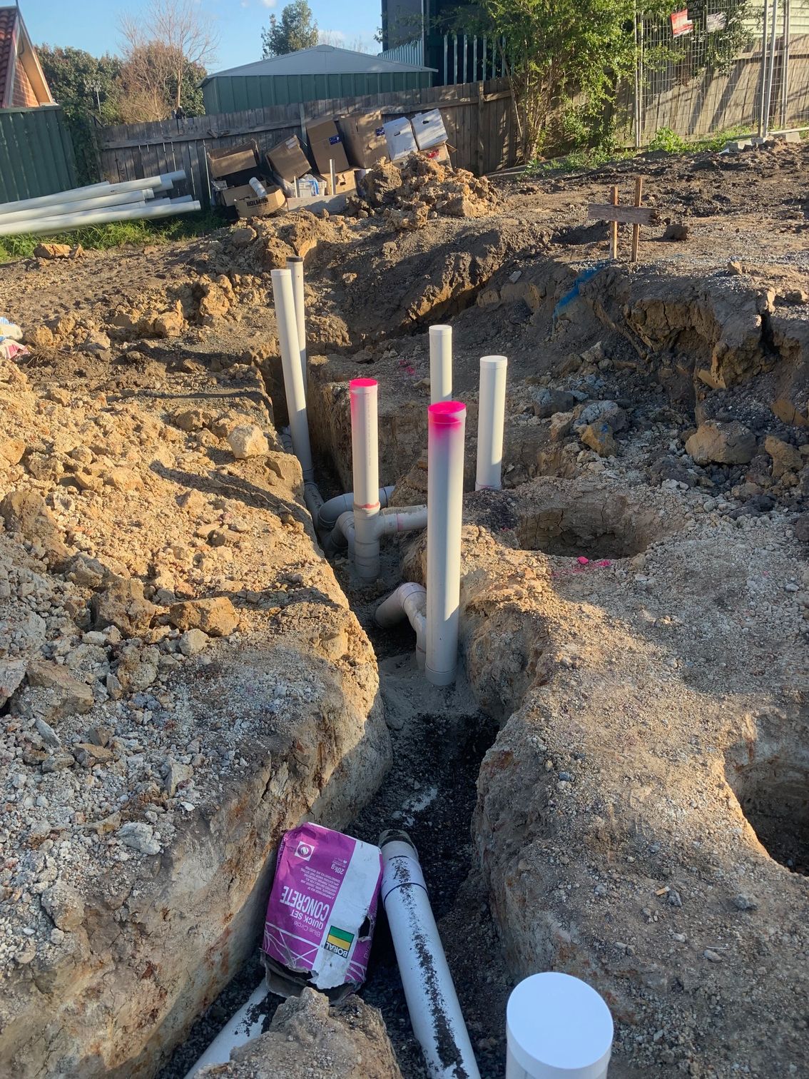 A Plumber Is Working On A Pipe Underground  — BAS Plumbing & Drainage In Erina, NSW
