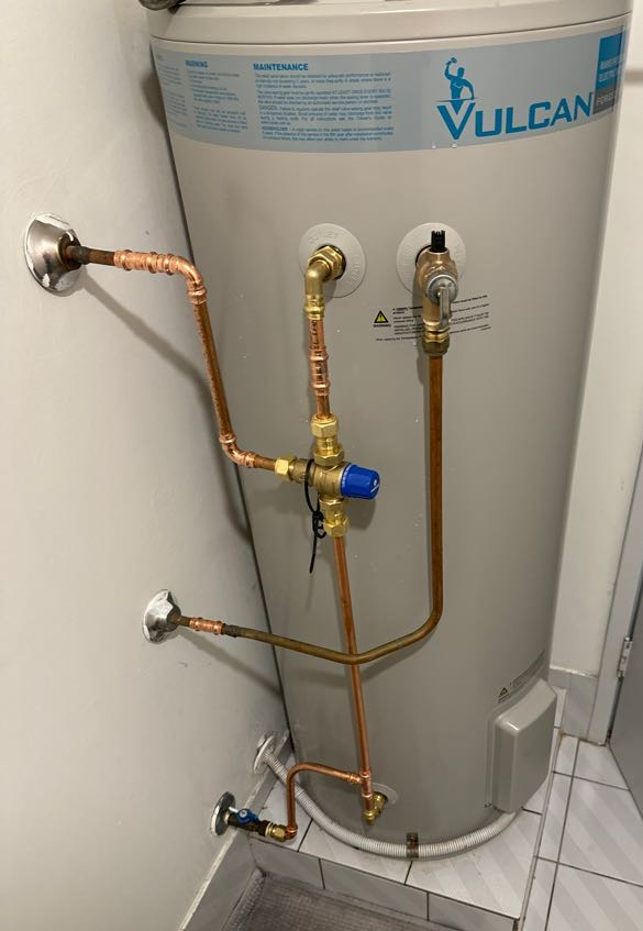 A Water Heater With A Gauge Attached To It — BAS Plumbing & Drainage In Forresters Beach, NSW
