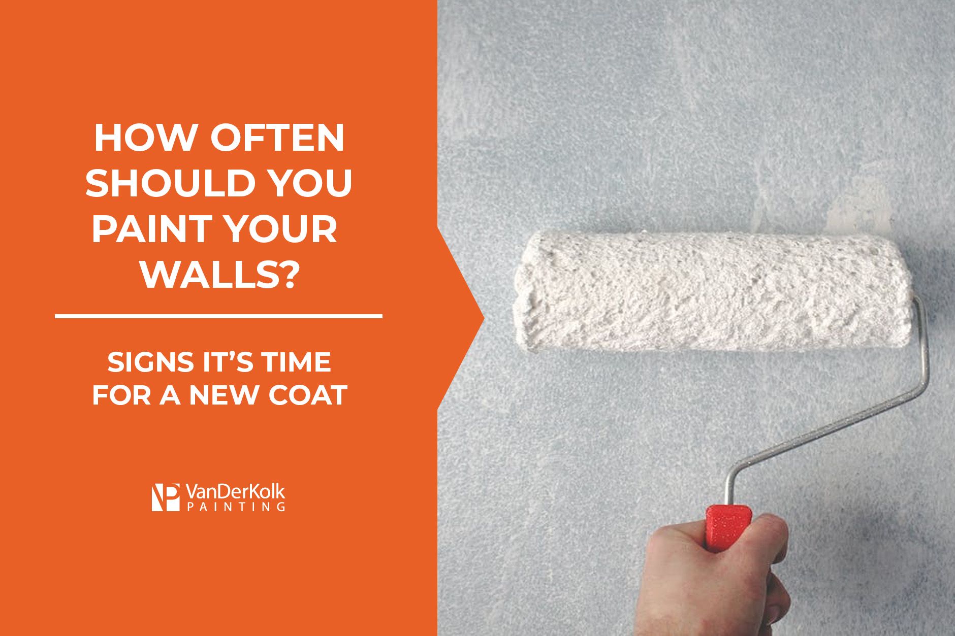 A person is holding a paint roller in front of a wall.